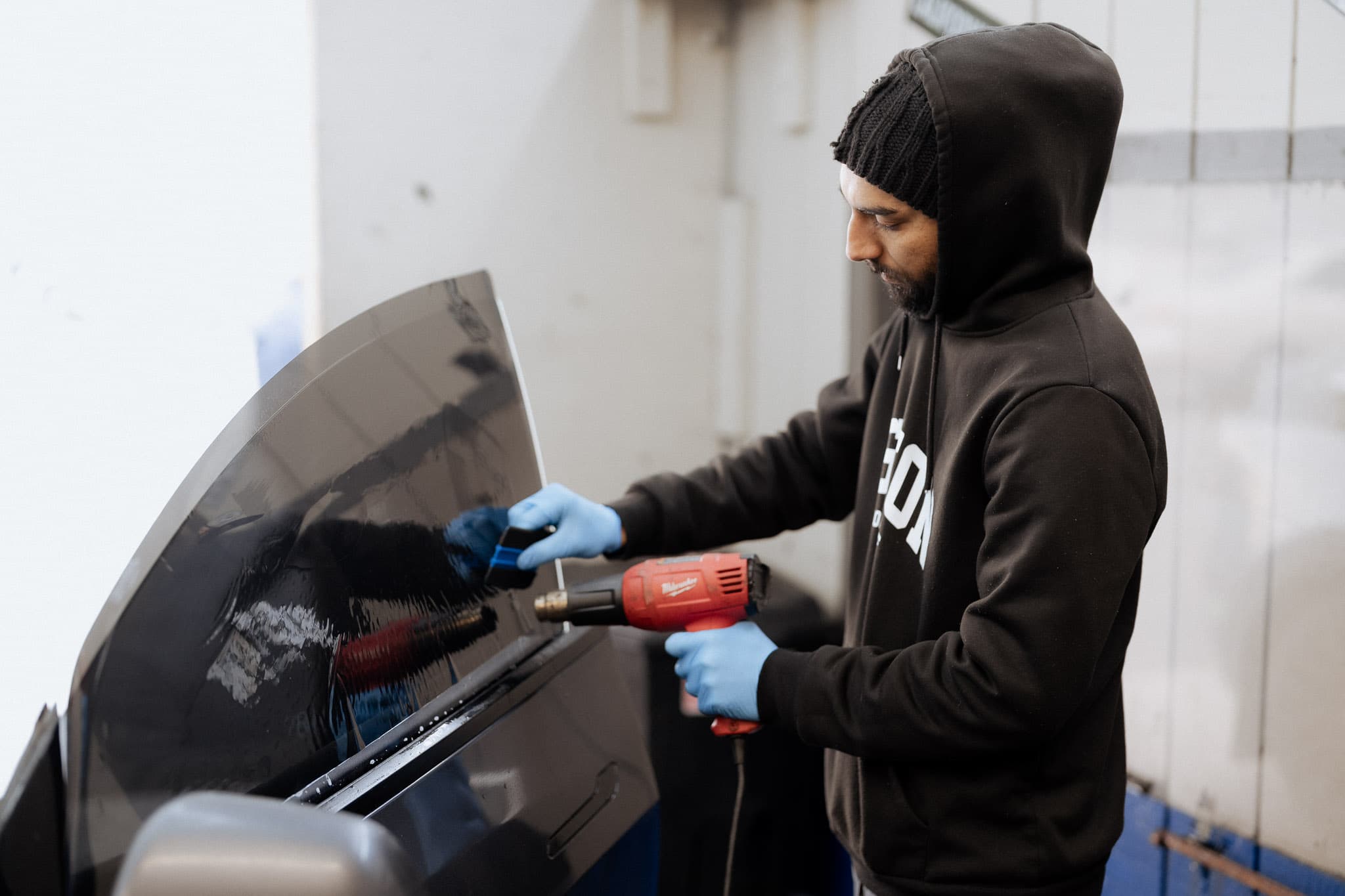 Professional window tinting โ technician applying tint film