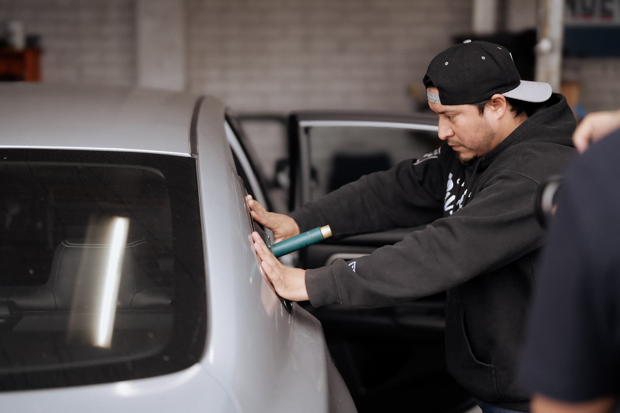 Professional windshield chip repair — technician working on Low Price Auto Glass